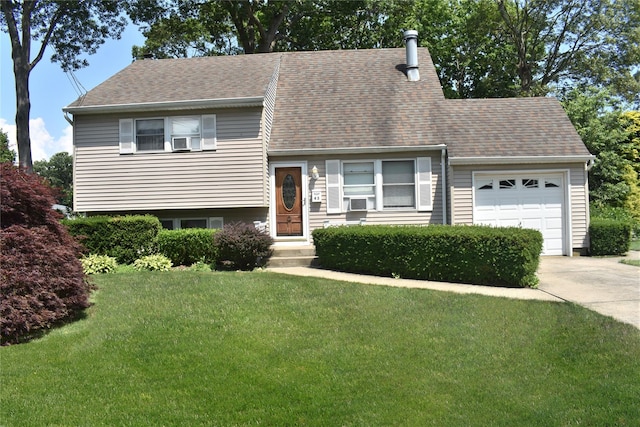 43 Circuit Rd, Bellport, NY 11713 - split level home with an attached garage, concrete driveway, a front yard, and a shingled roof