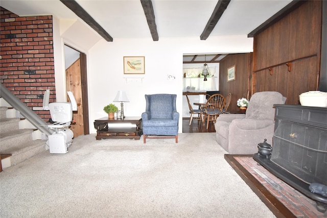 43 Circuit Rd, Bellport, NY 11713 - living area featuring beam ceiling, carpet floors, and stairs