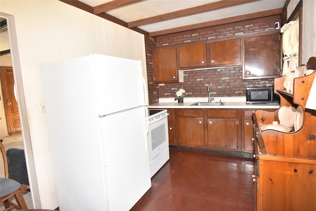 43 Circuit Rd, Bellport, NY 11713 - kitchen with white appliances, light countertops, brown cabinets, and beam ceiling