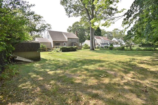 43 Circuit Rd, Bellport, NY 11713 - view of grassy yard with a storage unit