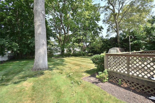 43 Circuit Rd, Bellport, NY 11713 - view of grassy yard with a storage shed and view of wooded area