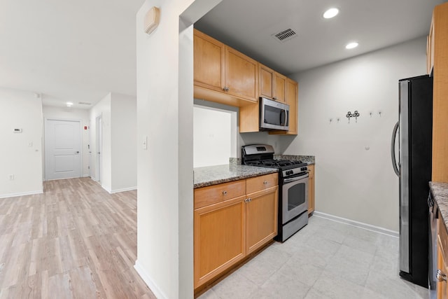 APTA2-22 Constitution Pl Unit 167, College Point, NY 11356 - kitchen with stainless steel appliances, light stone countertops, recessed lighting, and light wood-type flooring