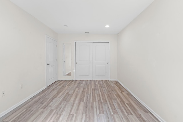 APTA2-22 Constitution Pl Unit 167, College Point, NY 11356 - unfurnished bedroom featuring light wood-type flooring, a closet, and recessed lighting