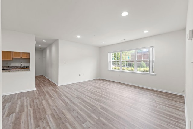 APTA2-22 Constitution Pl Unit 167, College Point, NY 11356 - unfurnished living room featuring light wood-style floors and recessed lighting