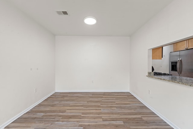 APTA2-22 Constitution Pl Unit 167, College Point, NY 11356 - empty room with light wood finished floors