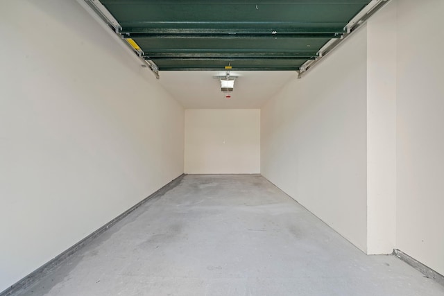 APTA2-22 Constitution Pl Unit 167, College Point, NY 11356 - garage featuring a garage door opener