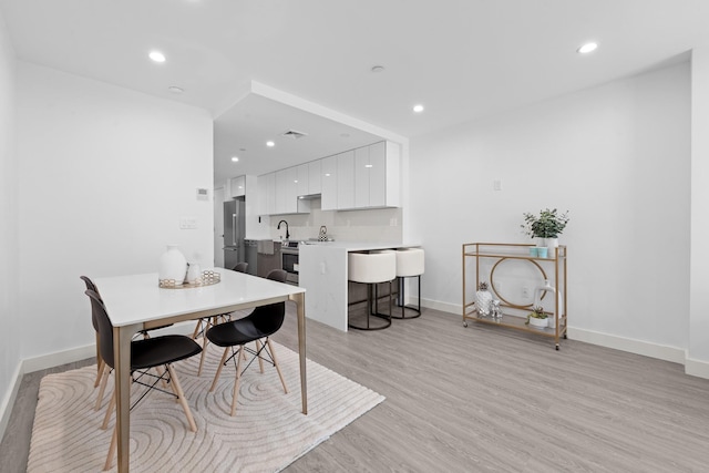 46-40 Vernon Blvd Unit 2B, Long Island City, NY 11101 - dining area with light wood-type flooring and recessed lighting