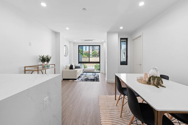 46-40 Vernon Blvd Unit 2B, Long Island City, NY 11101 - dining area featuring light wood-type flooring and recessed lighting