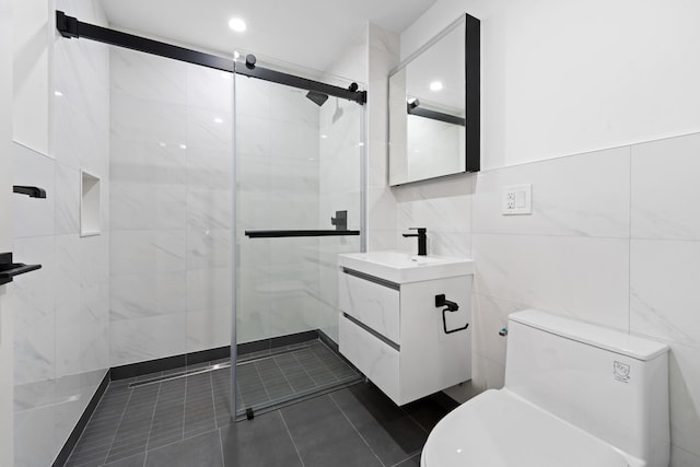 46-40 Vernon Blvd Unit 2B, Long Island City, NY 11101 - full bathroom featuring pet washing area, a shower stall, tile walls, vanity, and tile patterned flooring