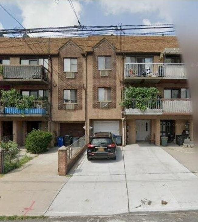 42-38 157th, Flushing, NY 11355 - view of property with driveway and an attached garage