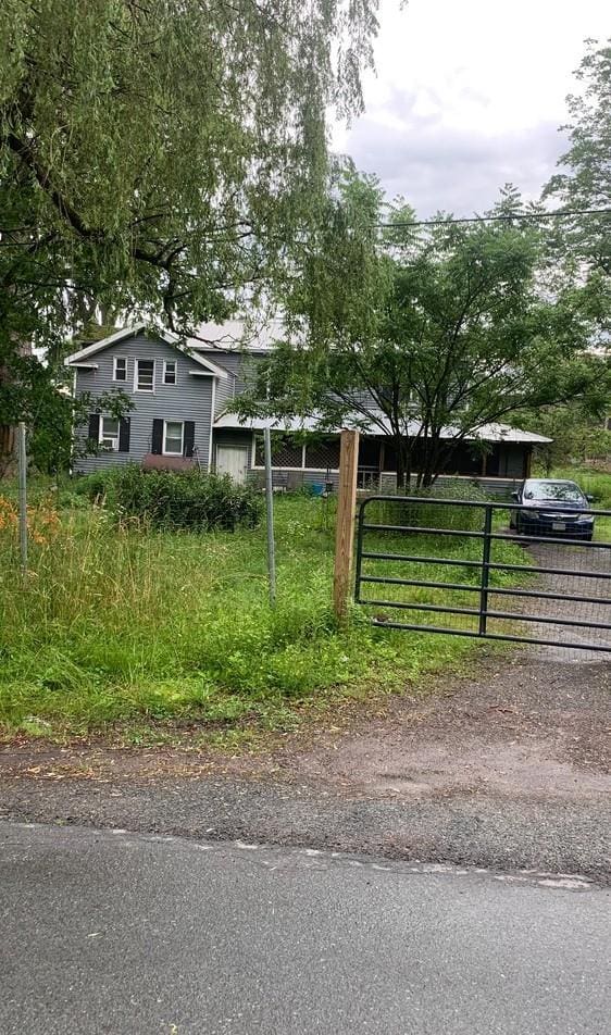 3 Burr Rd, Cochecton, NY 12726 - view of front of home featuring driveway and a gate