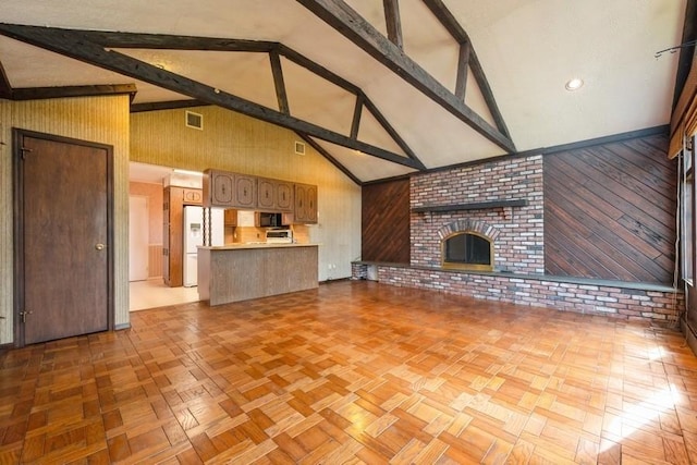 709 Seabury Ave, Franklin Square, NY 11010 - unfurnished living room with high vaulted ceiling, wooden walls, beam ceiling, and a brick fireplace