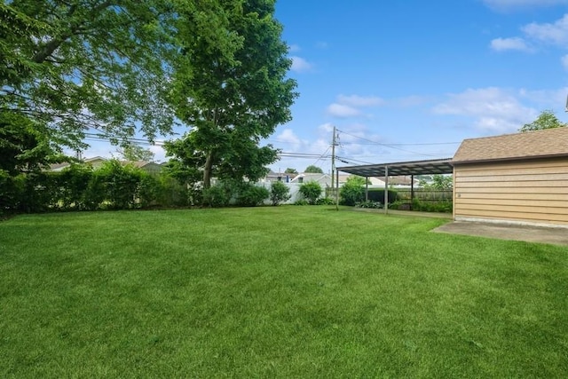 709 Seabury Ave, Franklin Square, NY 11010 - fenced backyard featuring a carport