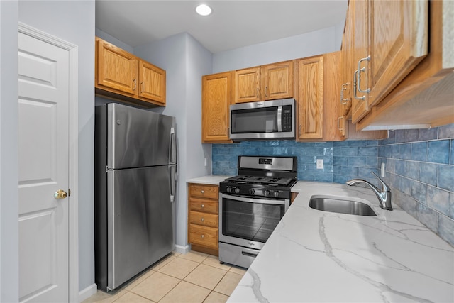 1410 Half Moon Bay Dr, Croton-On-Hudson, NY 10520 - kitchen with appliances with stainless steel finishes, light stone countertops, tasteful backsplash, light tile patterned floors, and brown cabinets