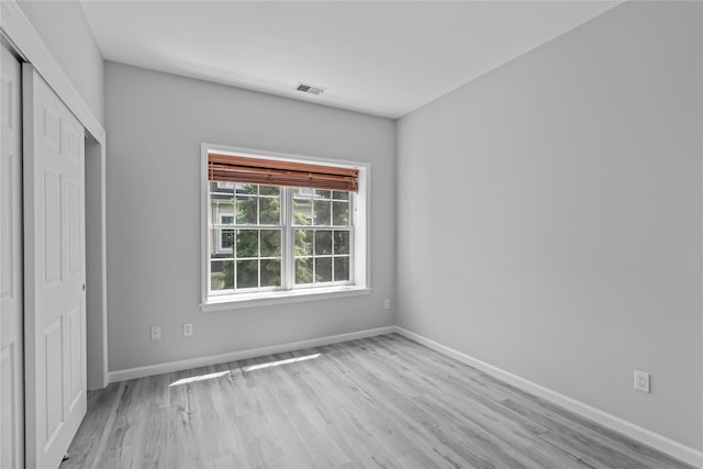 1410 Half Moon Bay Dr, Croton-On-Hudson, NY 10520 - unfurnished bedroom featuring wood finished floors and a closet