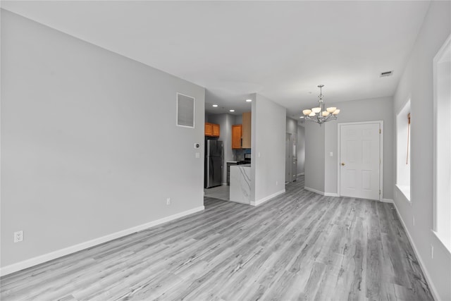 1410 Half Moon Bay Dr, Croton-On-Hudson, NY 10520 - unfurnished living room featuring a chandelier, light wood-style floors, and recessed lighting