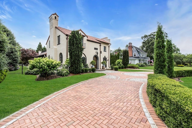 259 Lakeview Ave W, Brightwaters, NY 11718 - view of front of home with decorative driveway and a chimney