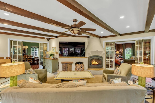 259 Lakeview Ave W, Brightwaters, NY 11718 - living room with beam ceiling, a large fireplace, a ceiling fan, a chandelier, and recessed lighting