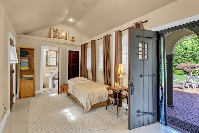 259 Lakeview Ave W, Brightwaters, NY 11718 - bedroom featuring lofted ceiling, access to exterior, light tile patterned floors, and connected bathroom