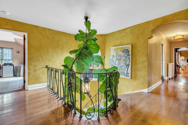 259 Lakeview Ave W, Brightwaters, NY 11718 - corridor with wood finished floors and arched walkways