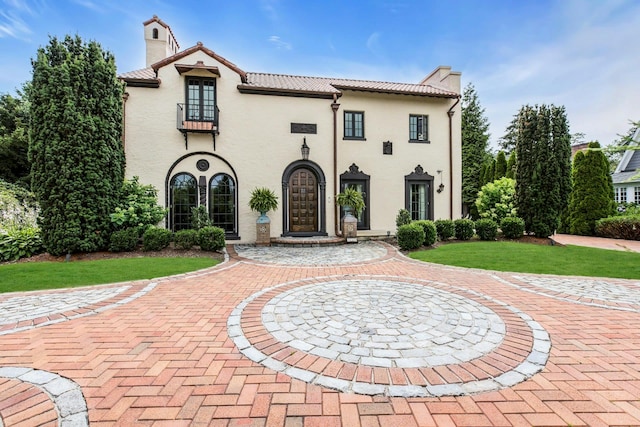 259 Lakeview Ave W, Brightwaters, NY 11718 - mediterranean / spanish house with a chimney, a tile roof, and stucco siding