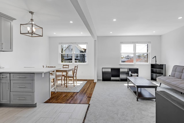 57 7th St, Pelham, NY 10803 - living room featuring plenty of natural light, wood finished floors, a chandelier, and recessed lighting