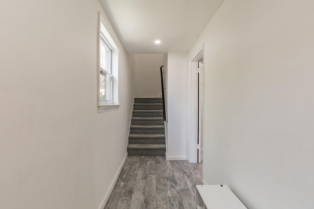 57 7th St, Pelham, NY 10803 - corridor featuring wood finished floors, stairs, and recessed lighting