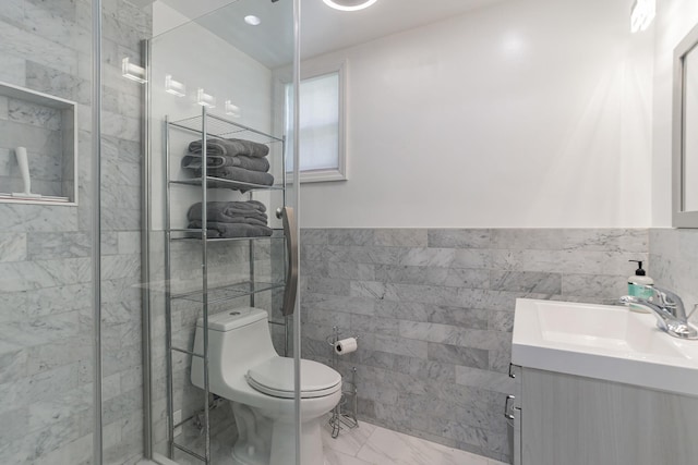 57 7th St, Pelham, NY 10803 - full bath featuring tile walls, vanity, marble finish flooring, a stall shower, and a wainscoted wall