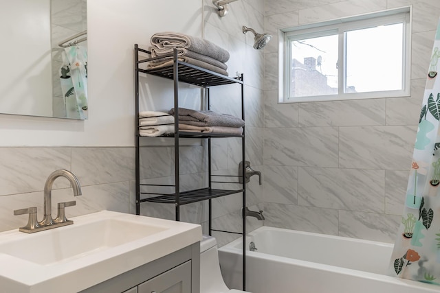 57 7th St, Pelham, NY 10803 - full bathroom featuring shower / bath combination with curtain, vanity, and tile walls
