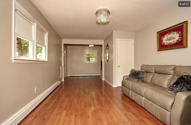 6 Schevchenko Pl, Monsey, NY 10977 - living area featuring baseboard heating and wood finished floors