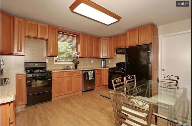 6 Schevchenko Pl, Monsey, NY 10977 - kitchen featuring black appliances, light countertops, light wood finished floors, and decorative backsplash