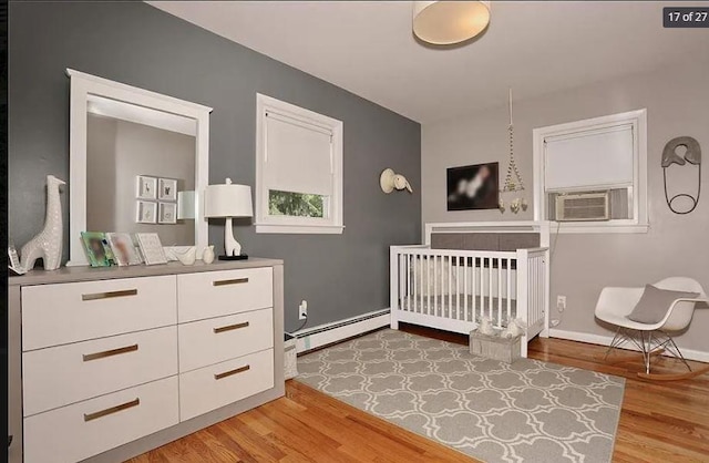 6 Schevchenko Pl, Monsey, NY 10977 - bedroom with a baseboard heating unit, cooling unit, and light wood-type flooring