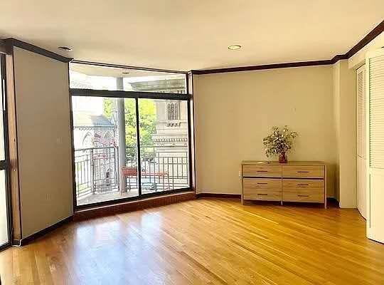 8 W 65th St Unit 5A, New York Manhattan, NY 10023 - unfurnished room featuring wood finished floors and crown molding