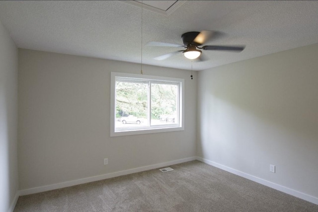 227 Springmeadow Dr Unit E, Holbrook, NY 11741 - empty room with a textured ceiling, ceiling fan, light carpet, and attic access