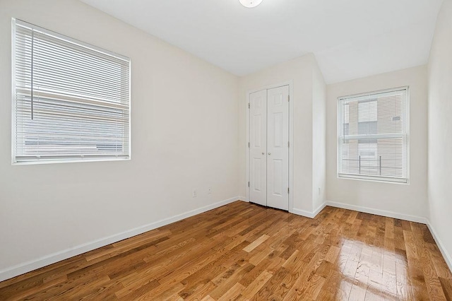 16407 Goethals Ave, Jamaica, NY 11432 - unfurnished bedroom with light wood-style floors and a closet