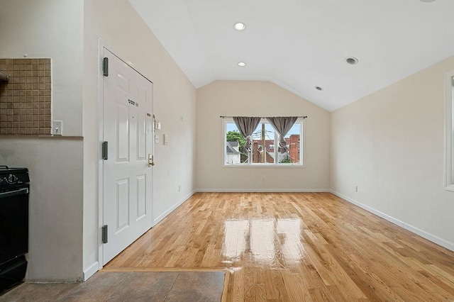 16407 Goethals Ave, Jamaica, NY 11432 - entryway featuring vaulted ceiling, wood finished floors, and recessed lighting
