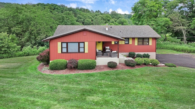 278 Fort Van Tyle Rd, Port Jervis, NY 12771 - view of front of home featuring a front lawn, roof with shingles, a wooded view, and driveway
