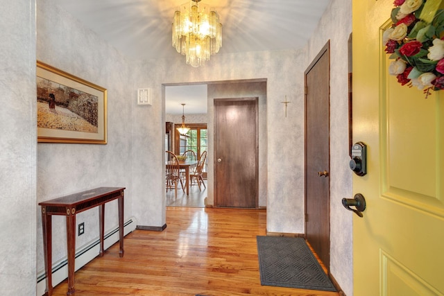 278 Fort Van Tyle Rd, Port Jervis, NY 12771 - foyer featuring light wood finished floors, a chandelier, and baseboard heating