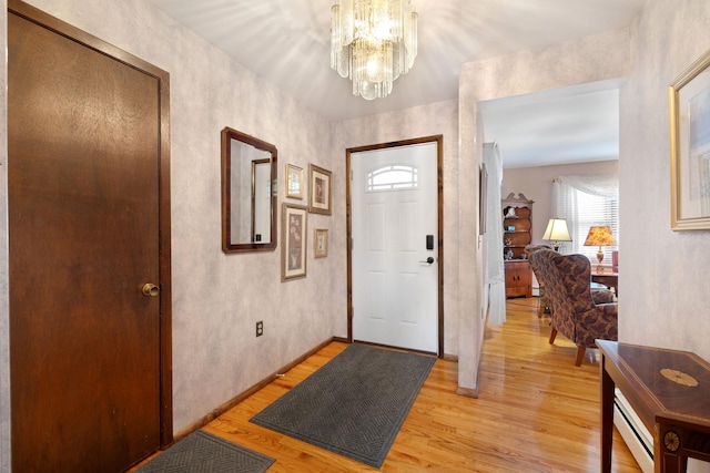 278 Fort Van Tyle Rd, Port Jervis, NY 12771 - entryway with light wood-style floors, a chandelier, and baseboard heating