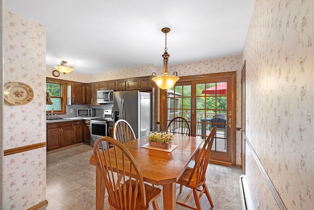 278 Fort Van Tyle Rd, Port Jervis, NY 12771 - dining room featuring wallpapered walls, plenty of natural light, and baseboard heating