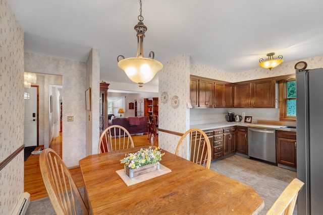 278 Fort Van Tyle Rd, Port Jervis, NY 12771 - dining area featuring wallpapered walls and a baseboard heating unit