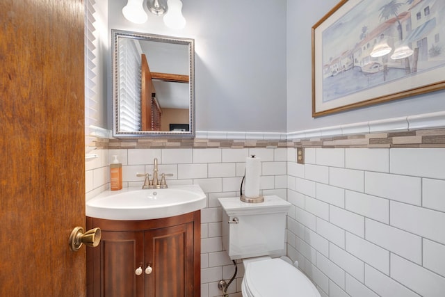 278 Fort Van Tyle Rd, Port Jervis, NY 12771 - bathroom featuring vanity, tile walls, and a wainscoted wall