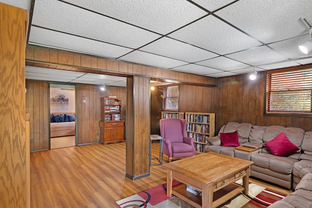 278 Fort Van Tyle Rd, Port Jervis, NY 12771 - living area with wooden walls, wood finished floors, and a drop ceiling