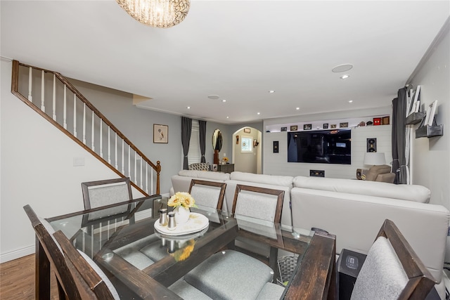 487 Court Ave, Cedarhurst, NY 11516 - dining space with arched walkways, stairway, wood finished floors, and recessed lighting