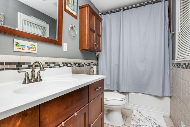 487 Court Ave, Cedarhurst, NY 11516 - bathroom featuring tile walls, vanity, tile patterned floors, and shower / bath combo with shower curtain