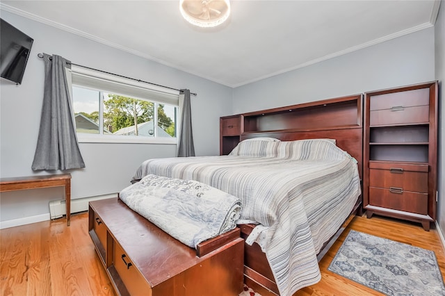 487 Court Ave, Cedarhurst, NY 11516 - bedroom with a baseboard radiator, ornamental molding, and light wood-type flooring