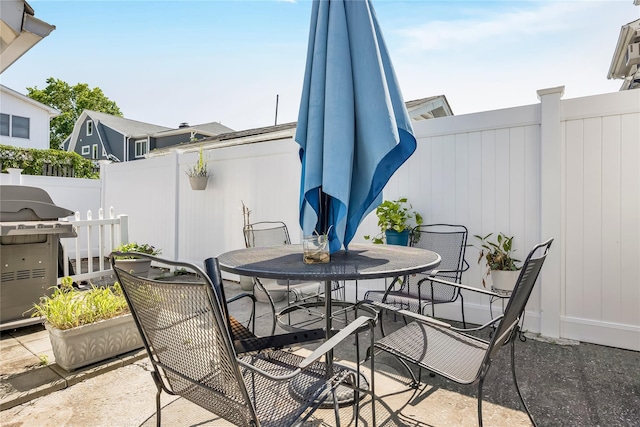 487 Court Ave, Cedarhurst, NY 11516 - fenced backyard featuring outdoor dining space, grilling area, and a patio area