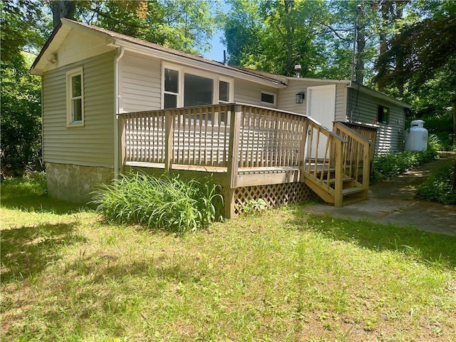 17 Hide Away Ln, Bloomingburg, NY 12721 - rear view of house with a wooden deck and a yard