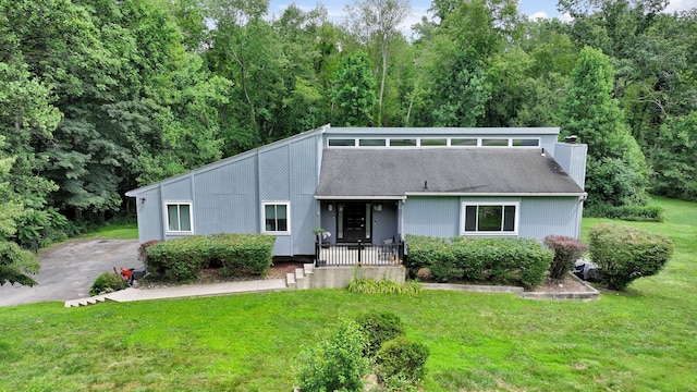 49 Flower Rd, Hopewell Junction, NY 12533 - mid-century inspired home featuring a front yard and a chimney