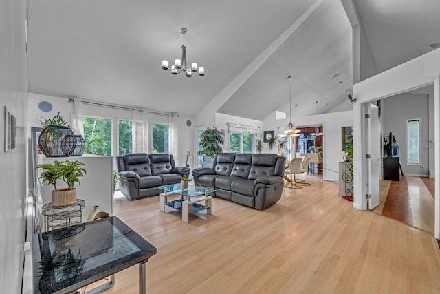 49 Flower Rd, Hopewell Junction, NY 12533 - living area featuring a chandelier, high vaulted ceiling, and wood finished floors